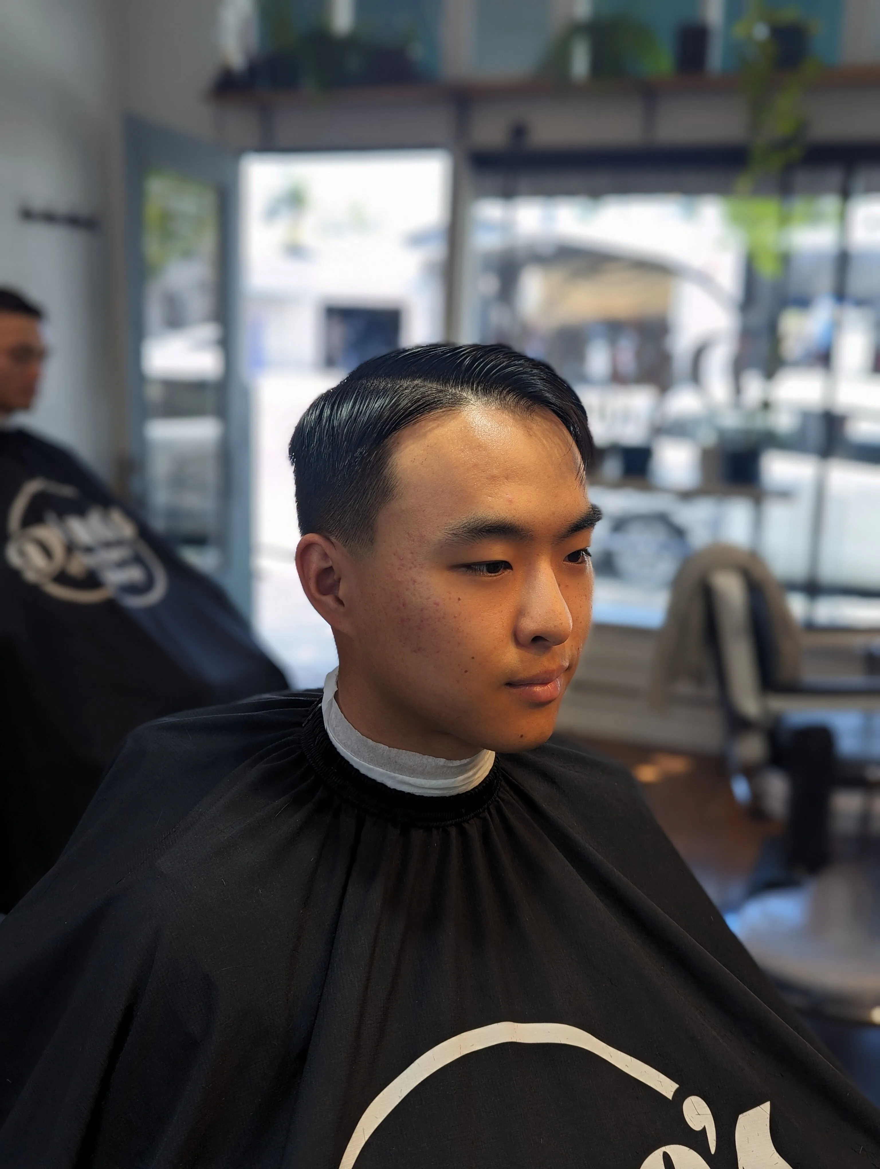 Expert barber cutting hair at Richmond VA location