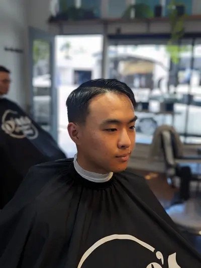 Expert barber cutting hair at Richmond VA location
