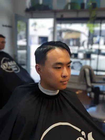 Expert barber cutting hair at Richmond VA location